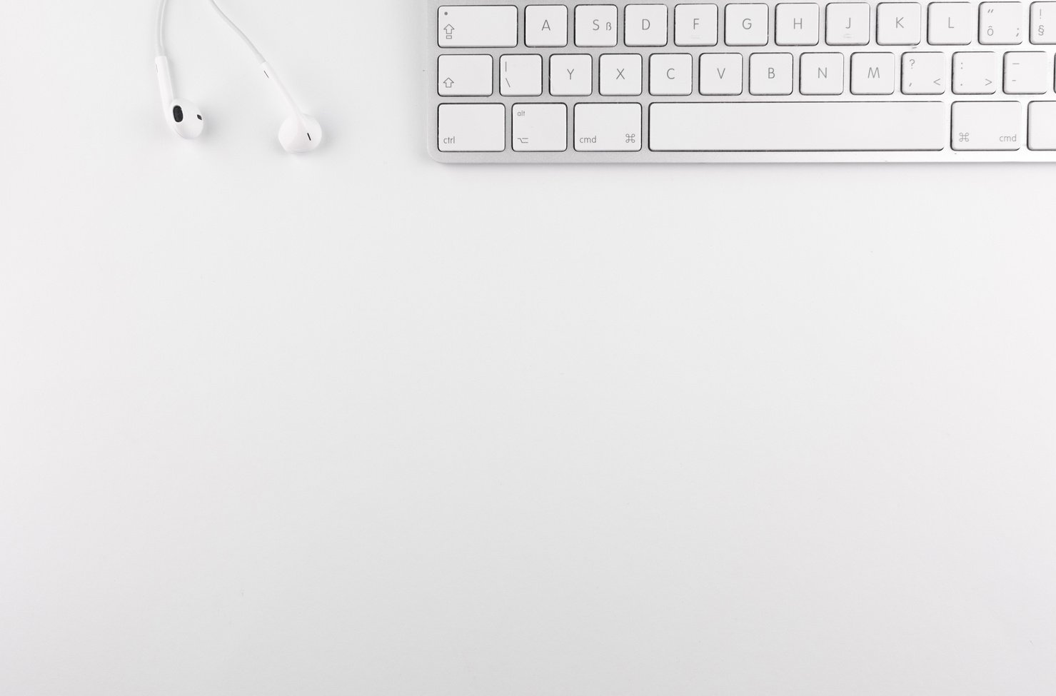 Top View Photo of Keyboard Near Earphones